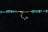 Multi-stone necklace with inlaid naja pendant