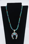Multi-stone necklace with inlaid naja pendant